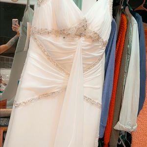 Never Worn.. Tried on & has been in bag since .. 3 small spots but will come out